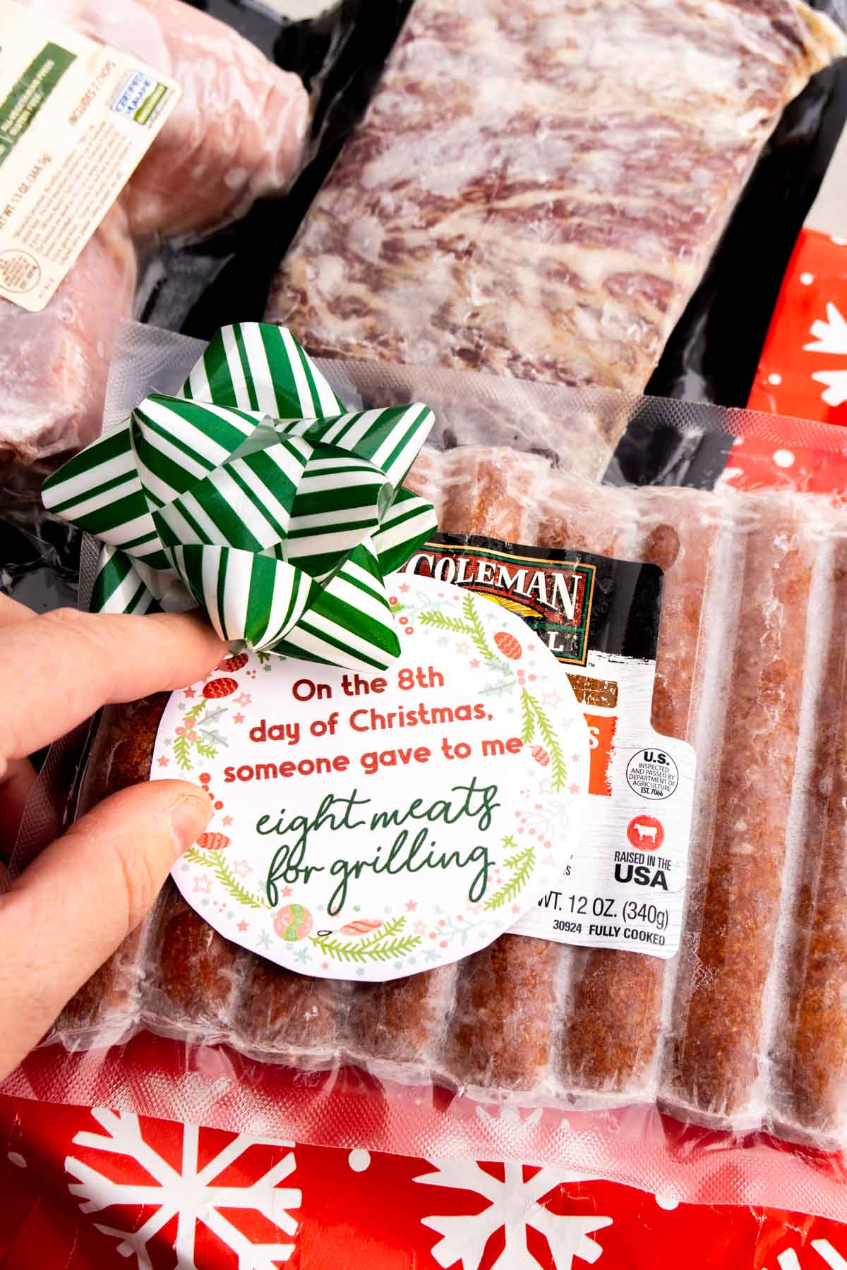 woman placing a gift tag on a meat based 12 days of christmas gifts