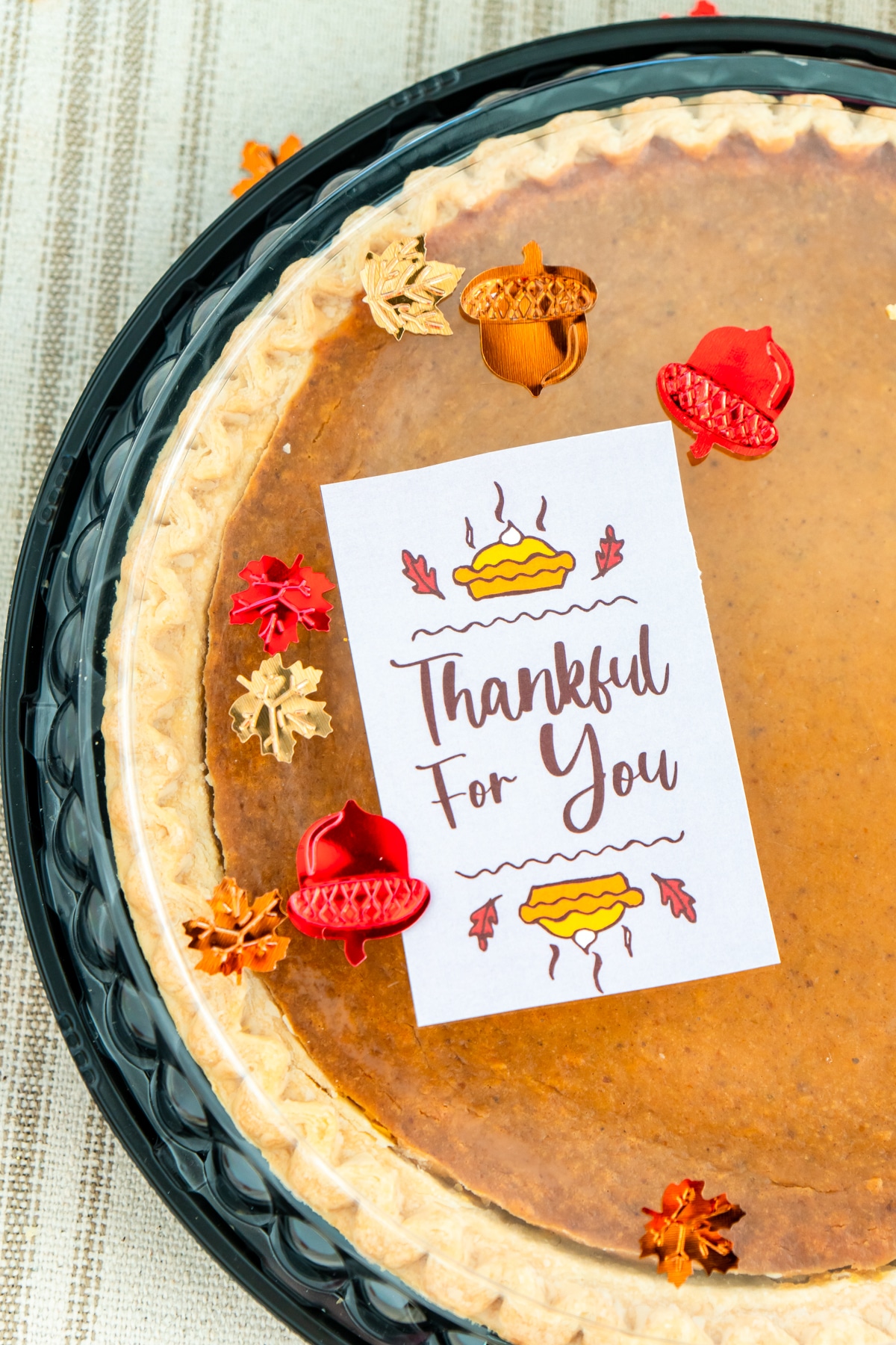 Thanksgiving gift tag on a pumpkin pie