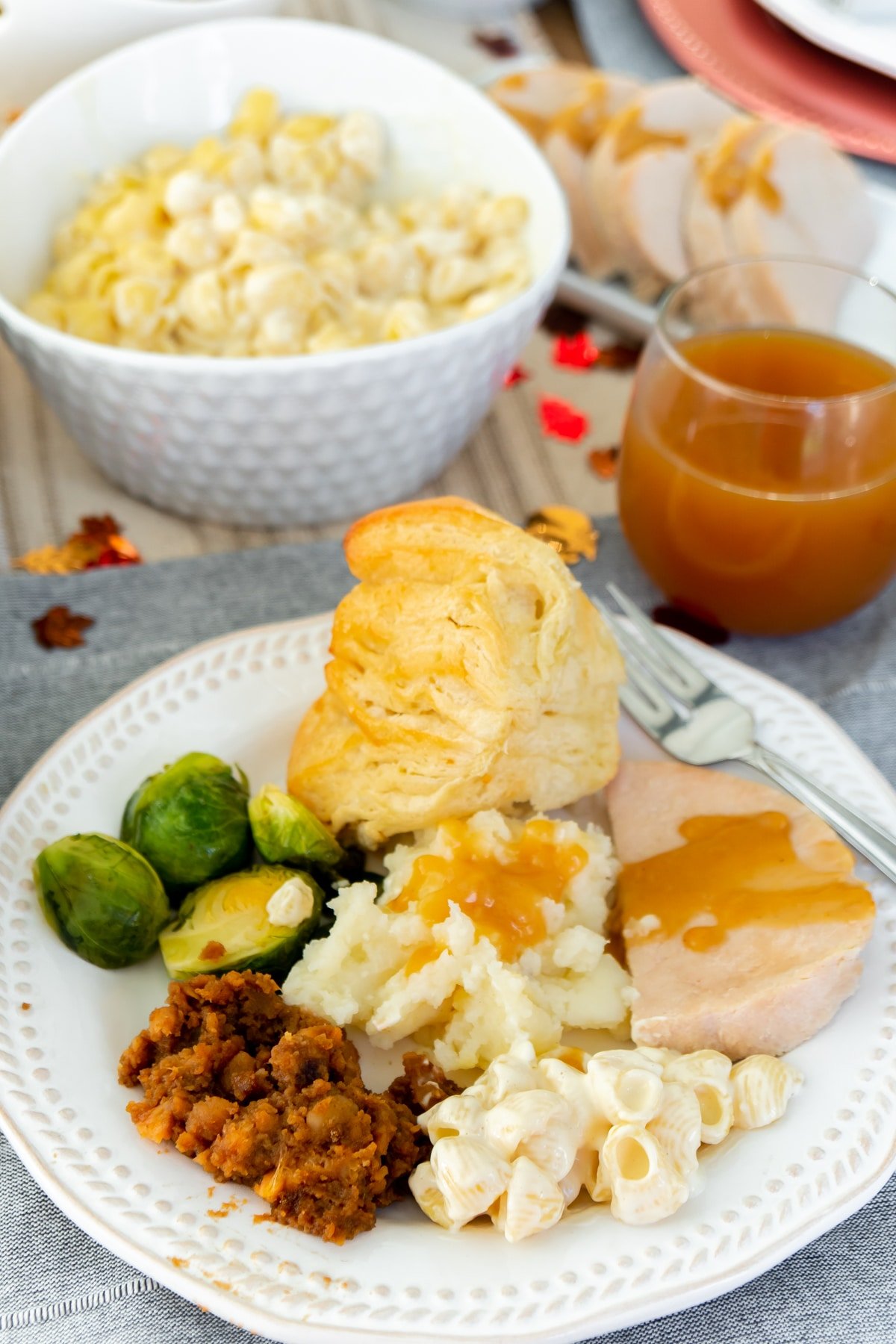 A white plate with a variety of Thanksgiving foods on it