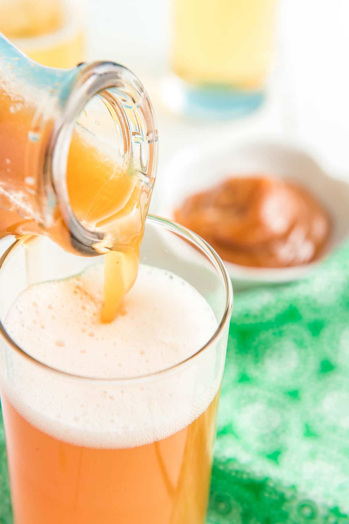 Pouring apple cider into a glass