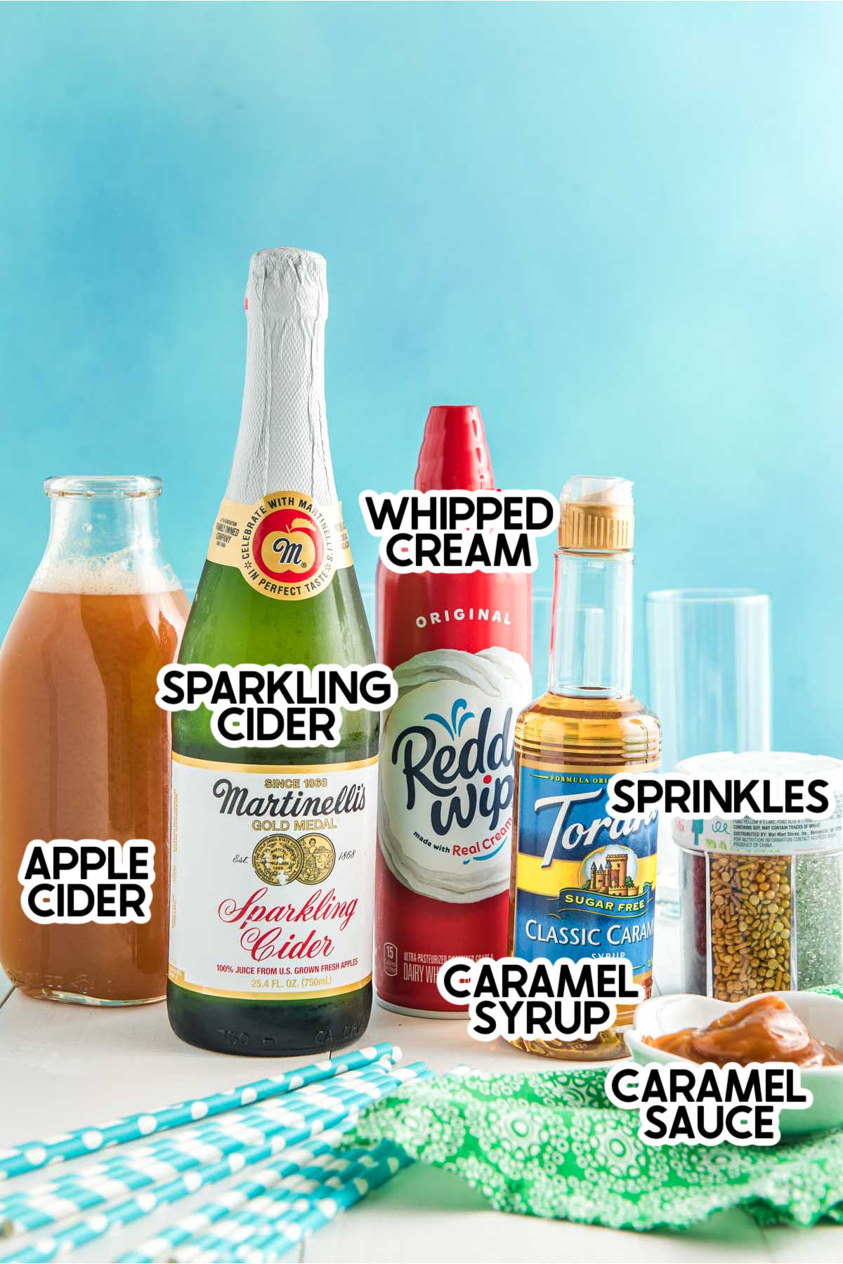 Ingredients needed for a caramel apple drink with labels