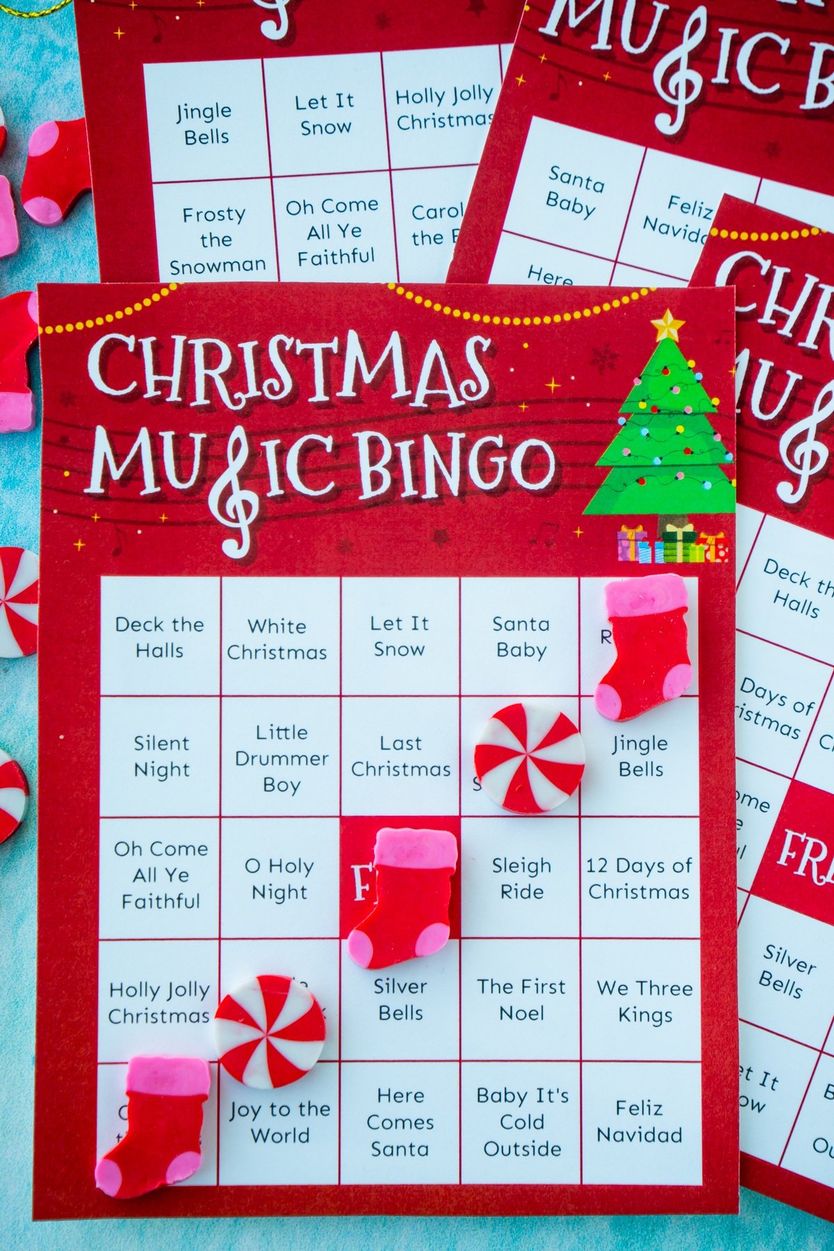 Christmas music bingo card with a bingo made out of Christmas erasers