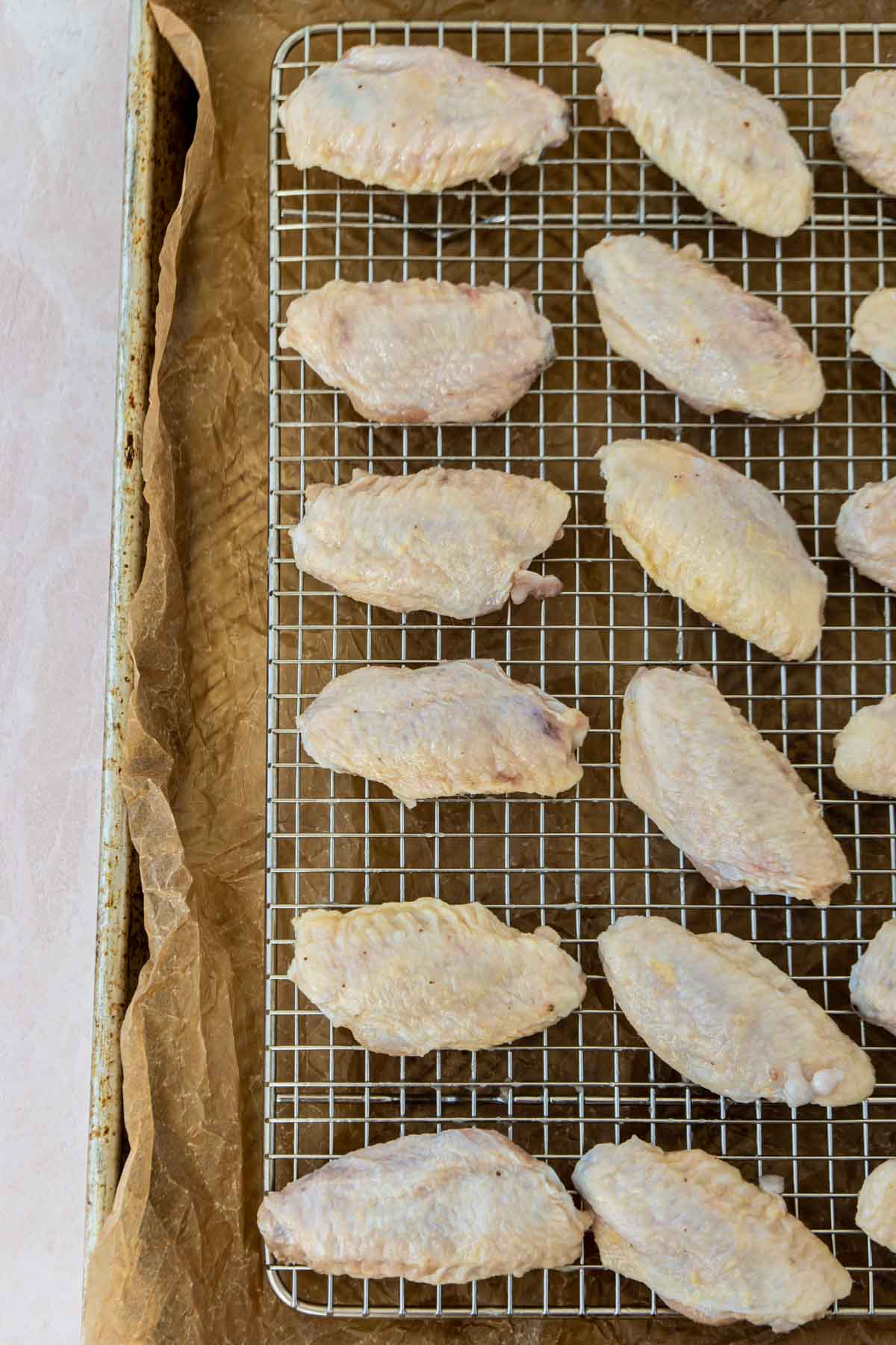 Chicken wings on a wire rack on a pan