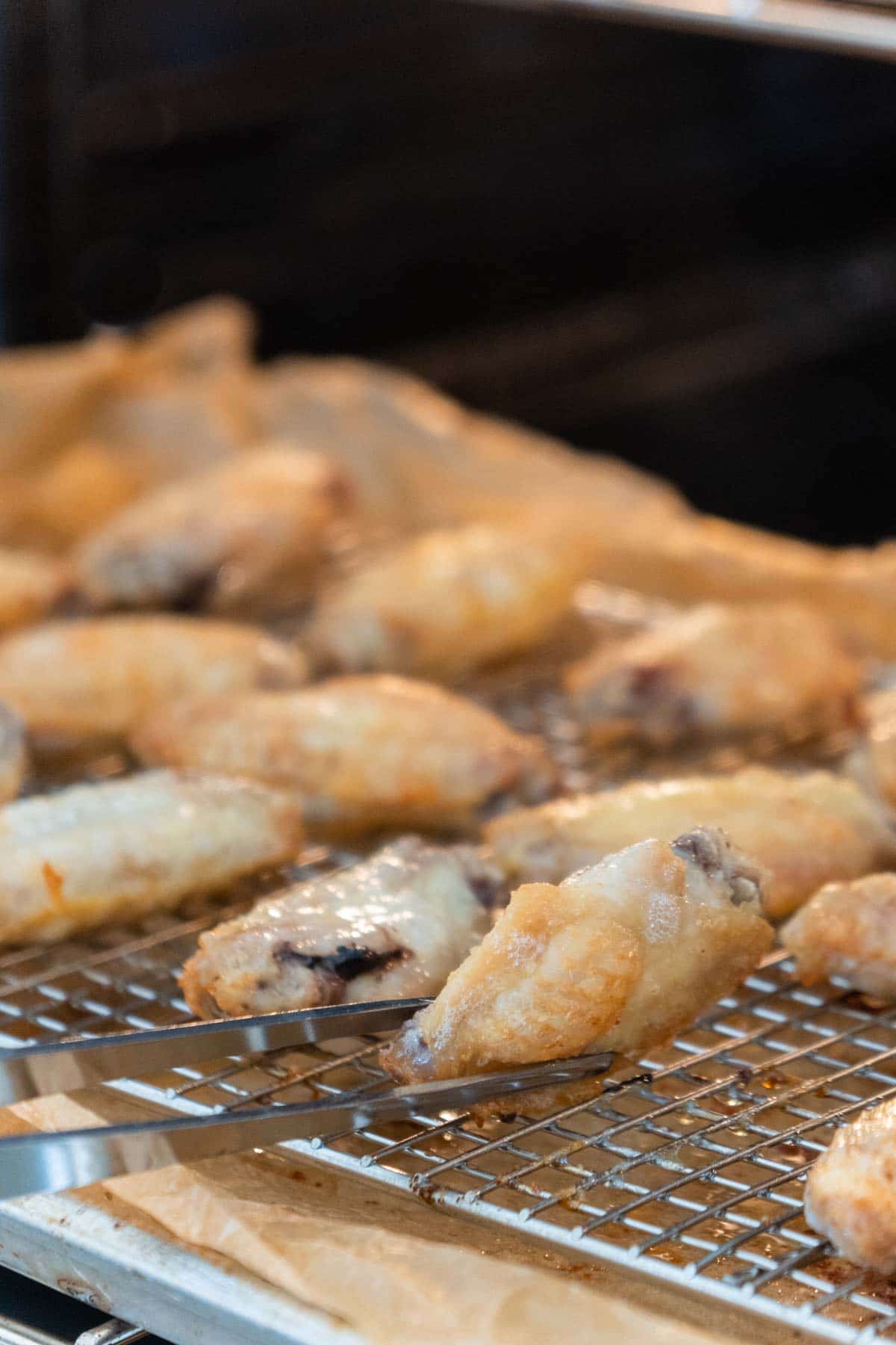 Flipping wings in an oven