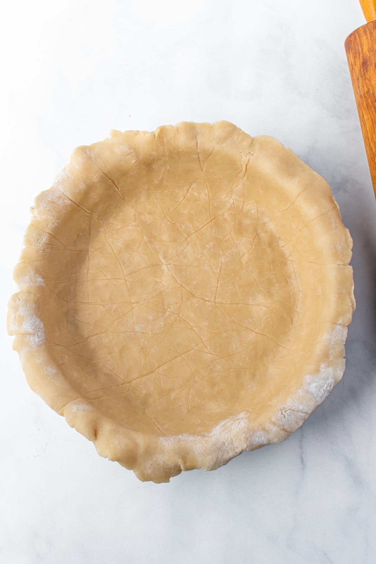 Apple pie crust in a pie pan