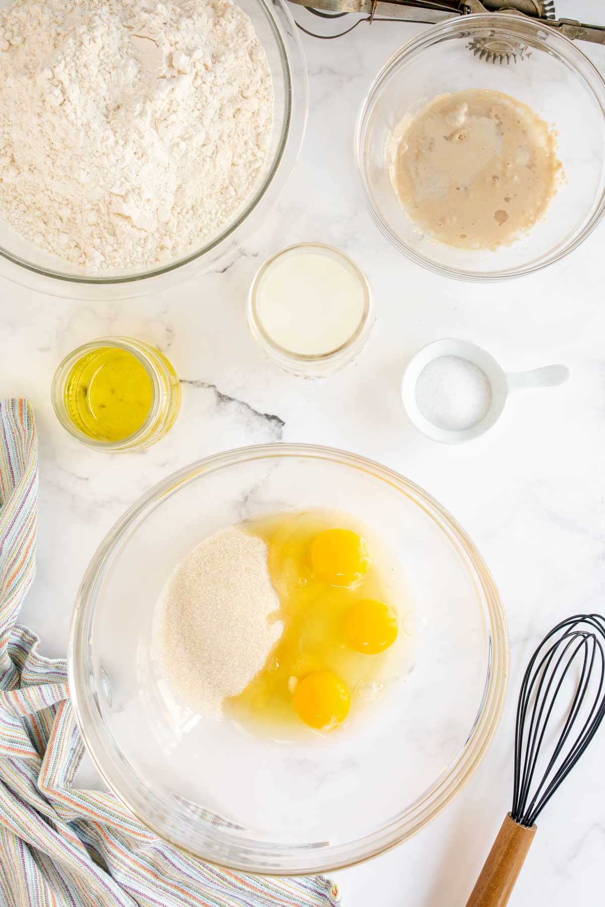 Glass bowl with eggs and sugar