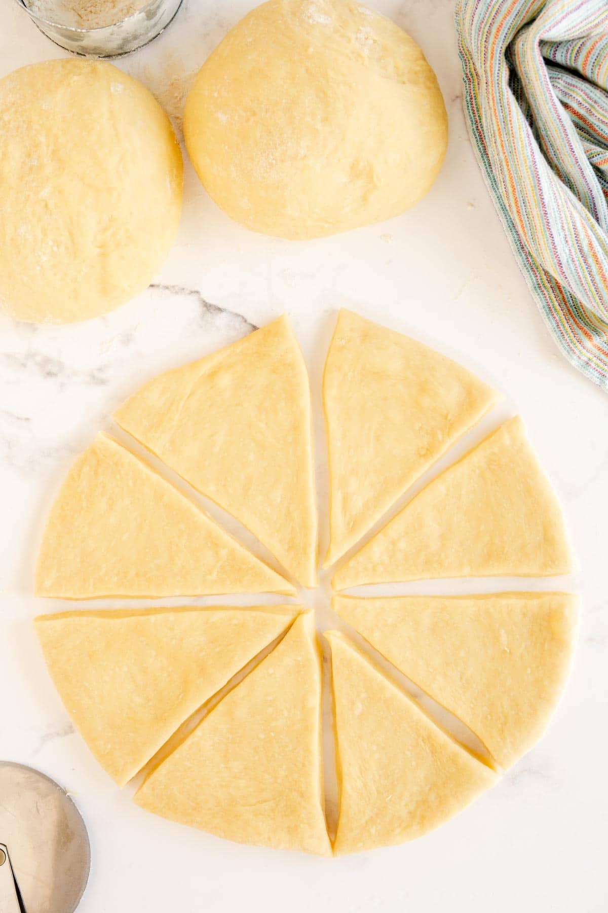 Crescent roll dough cut into eight wedges