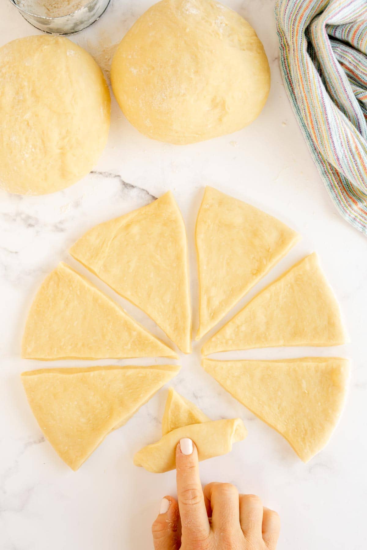 Hand rolling homemade crescent rolls