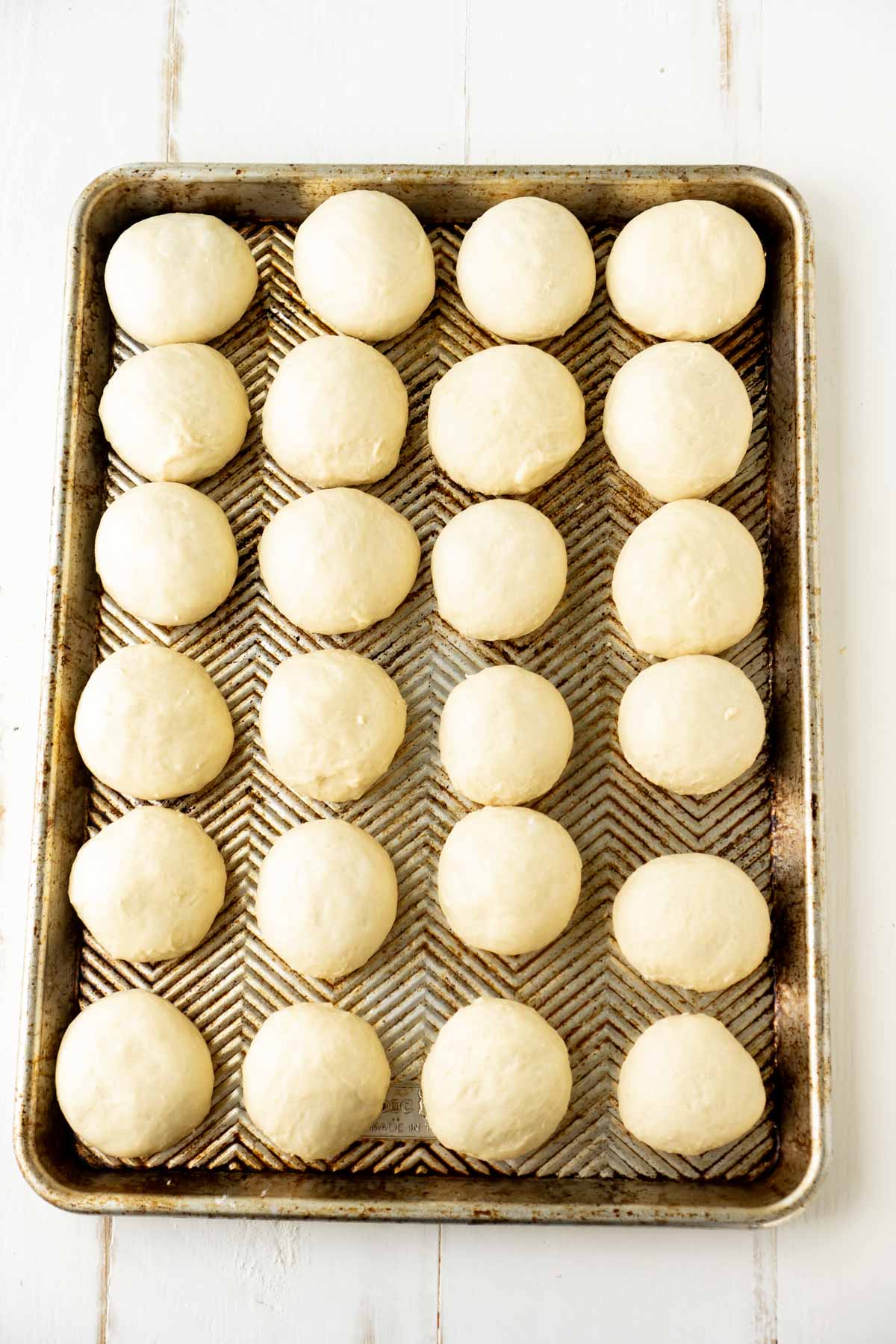 A sheet of homemade yeast rolls ready to be baked