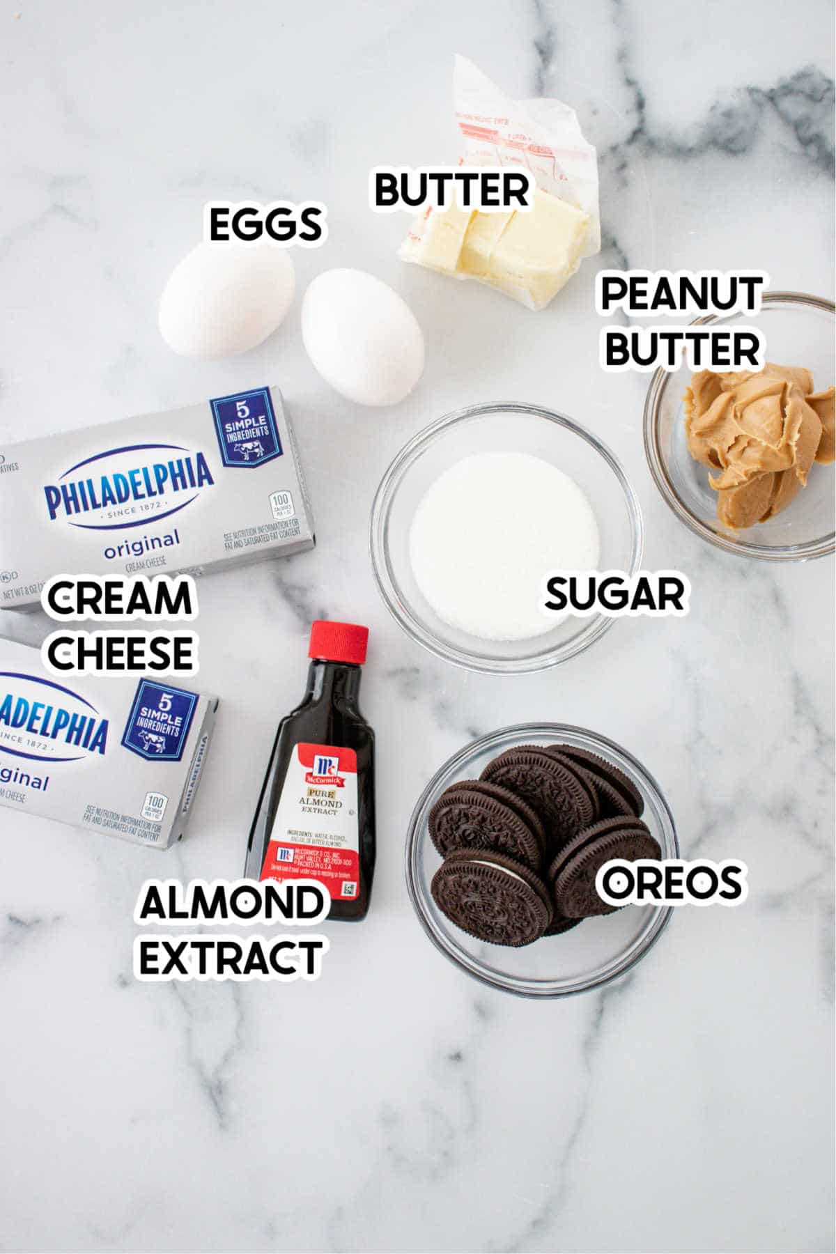 Ingredients to make mini Oreo cheesecakes with labels