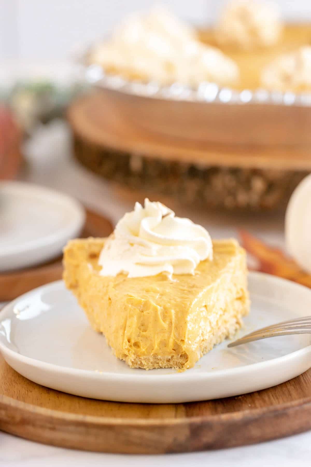 A slice o no bake pumpkin pie on a plate