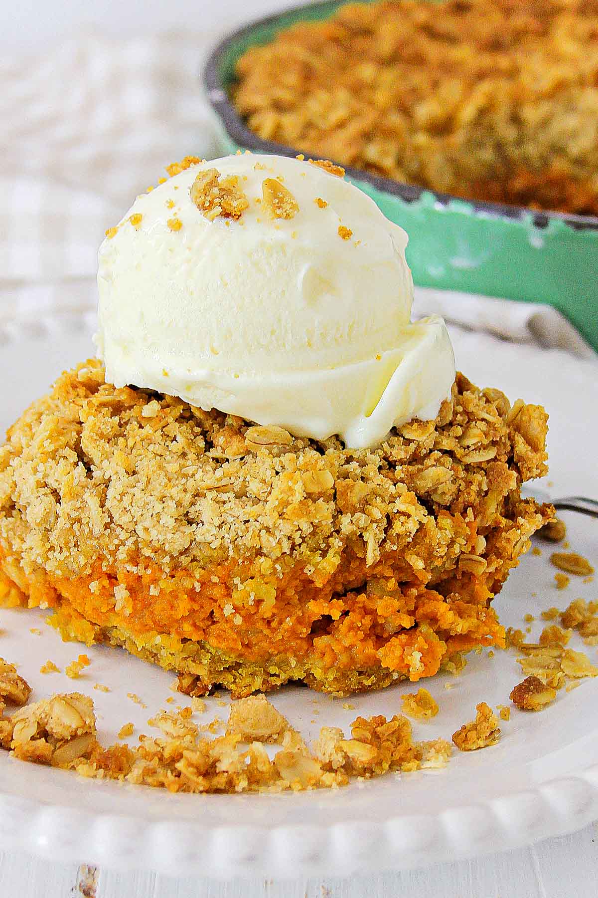 Piece of pumpkin crisp with ice cream on top