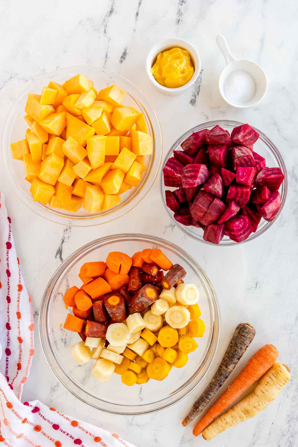 bowls of root vegetables chopped up