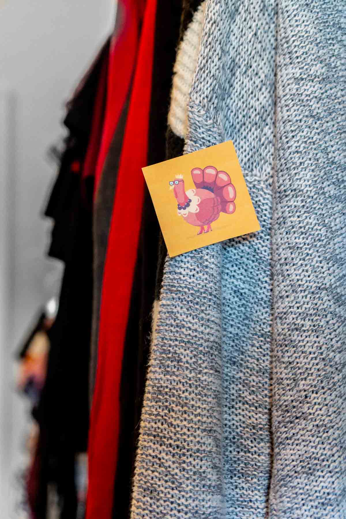 Turkey card hidden on a sweater in a closet