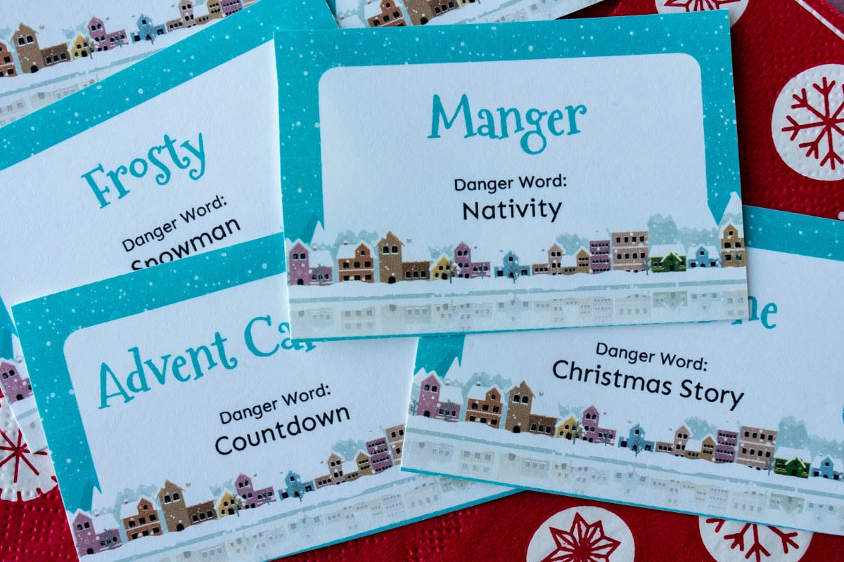 Horizontal photos of a pile of Christmas danger words cards