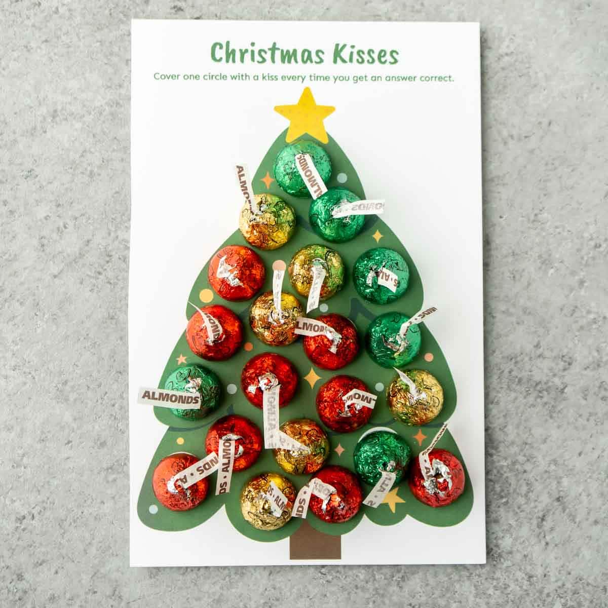 Christmas kisses Christmas trivia game with Hershey's kisses on top