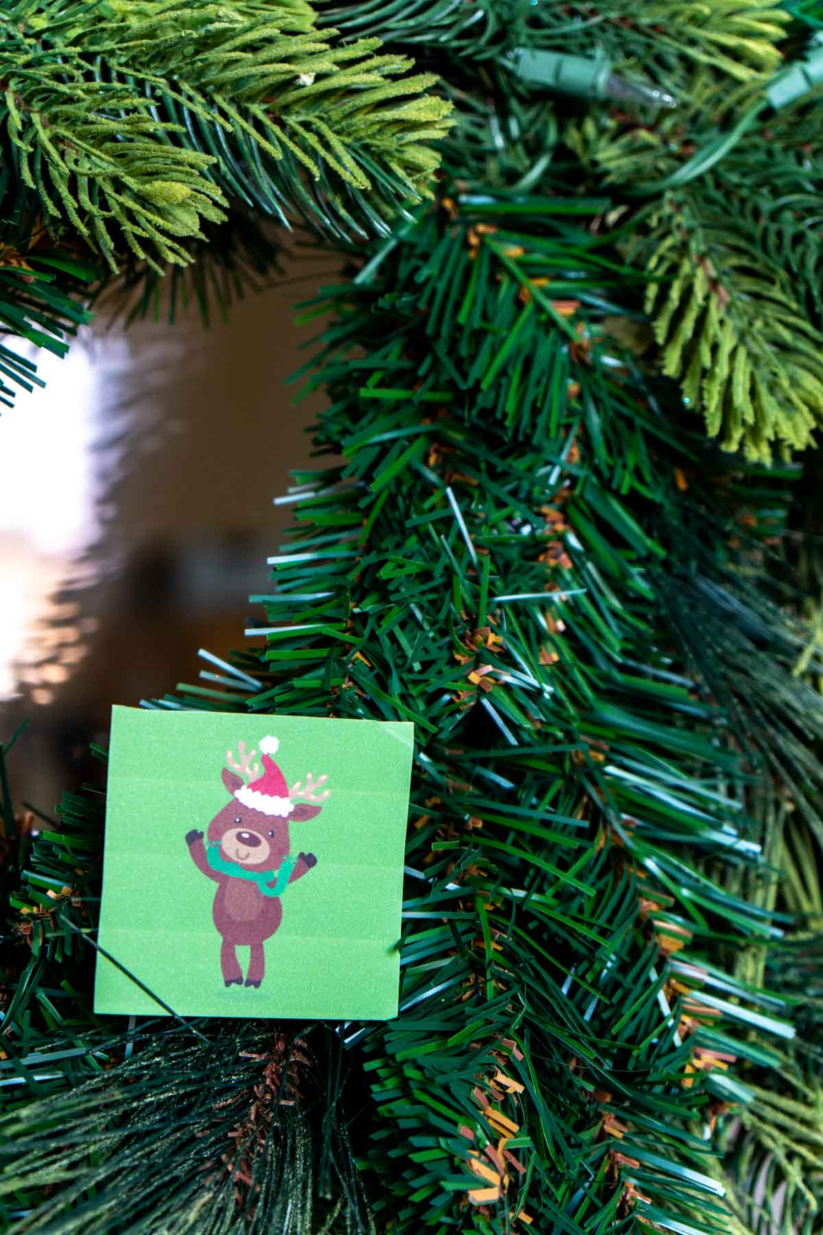 Reindeer card hidden on a wreath