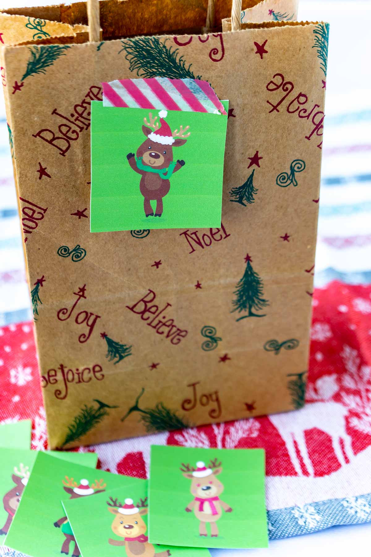 Brown paper bag with a reindeer hunt card on it