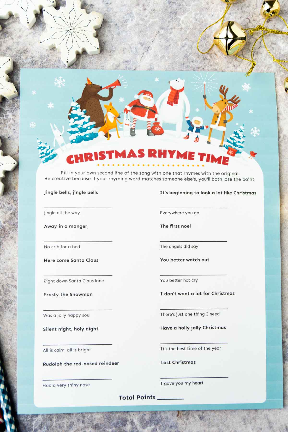 Christmas rhyme game printable with snowflakes in the background