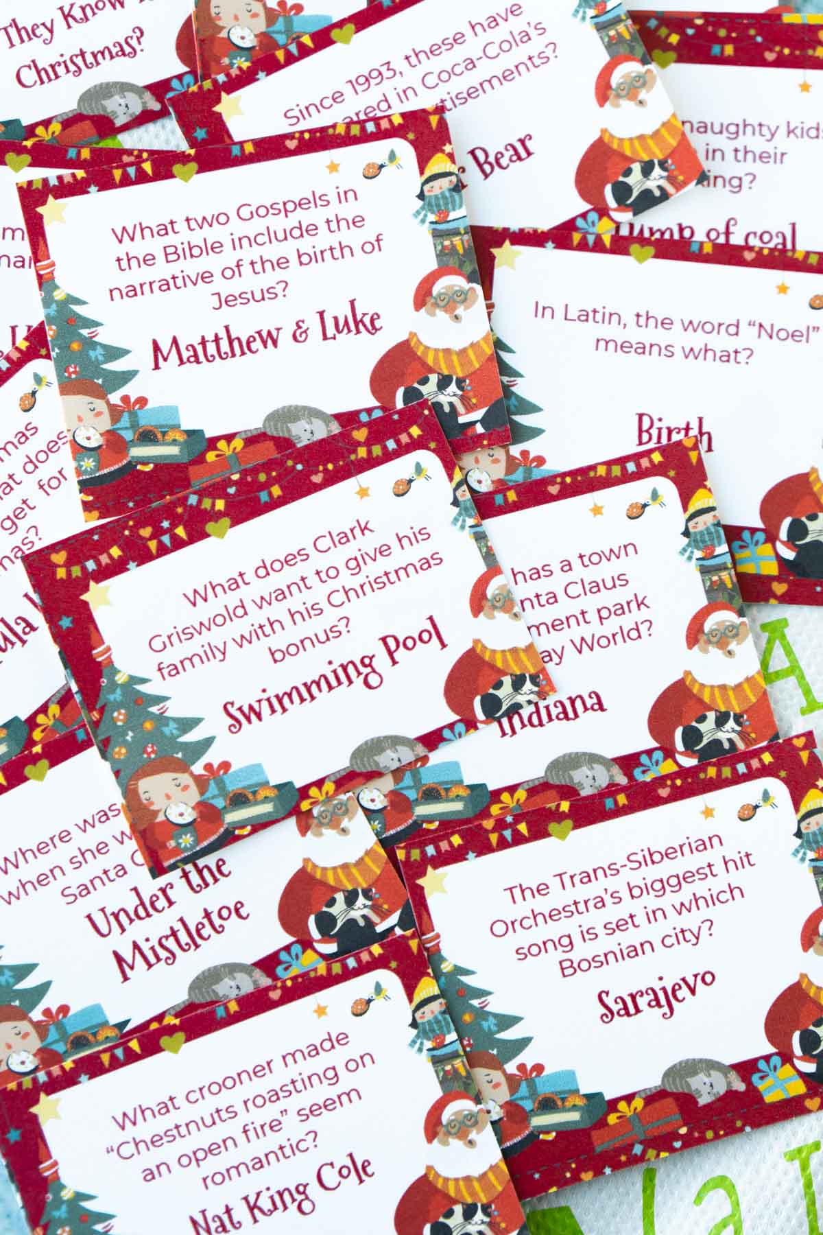 Christmas trivia questions on cards in a pile