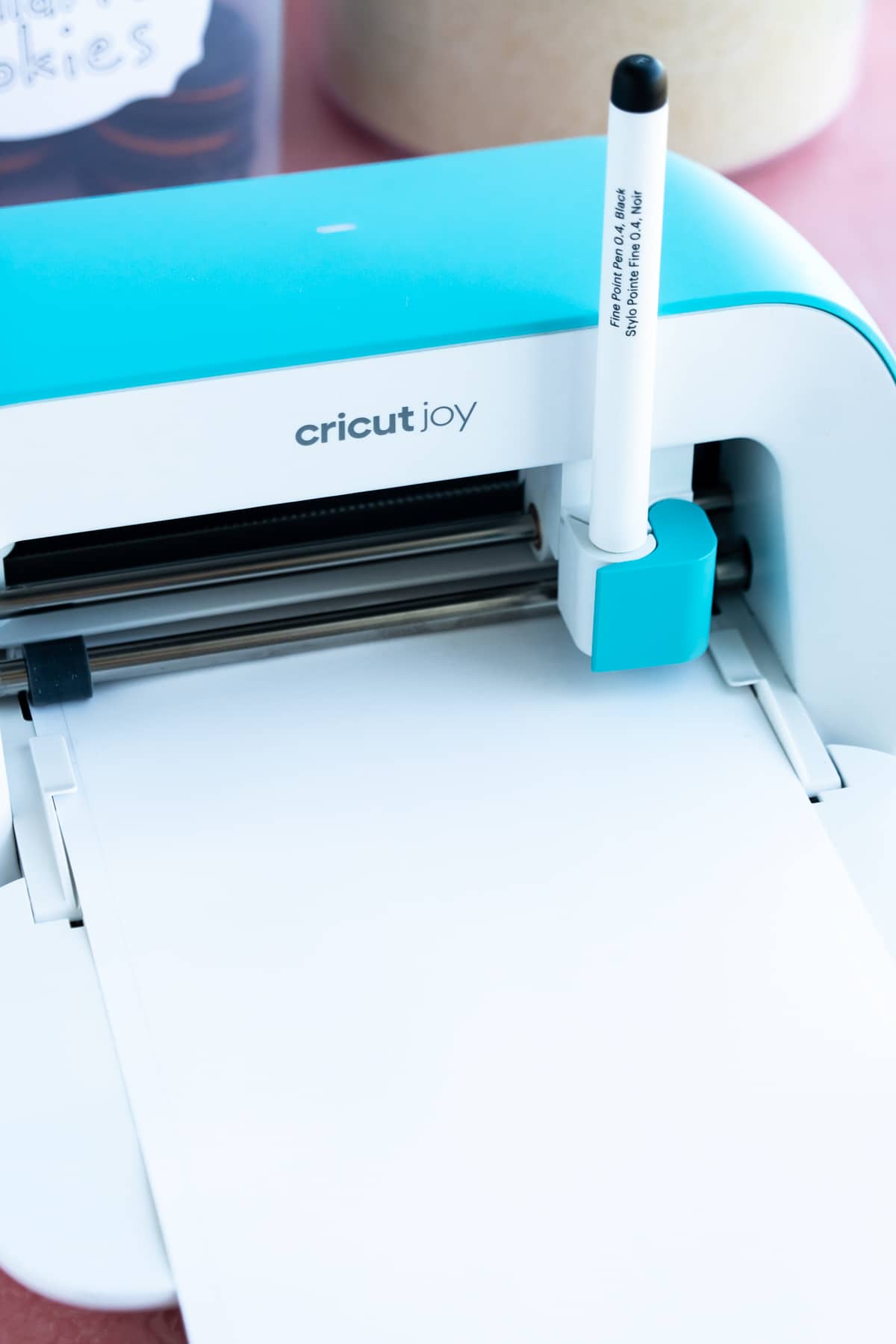 Cricut Joy loaded with a black fine point pen