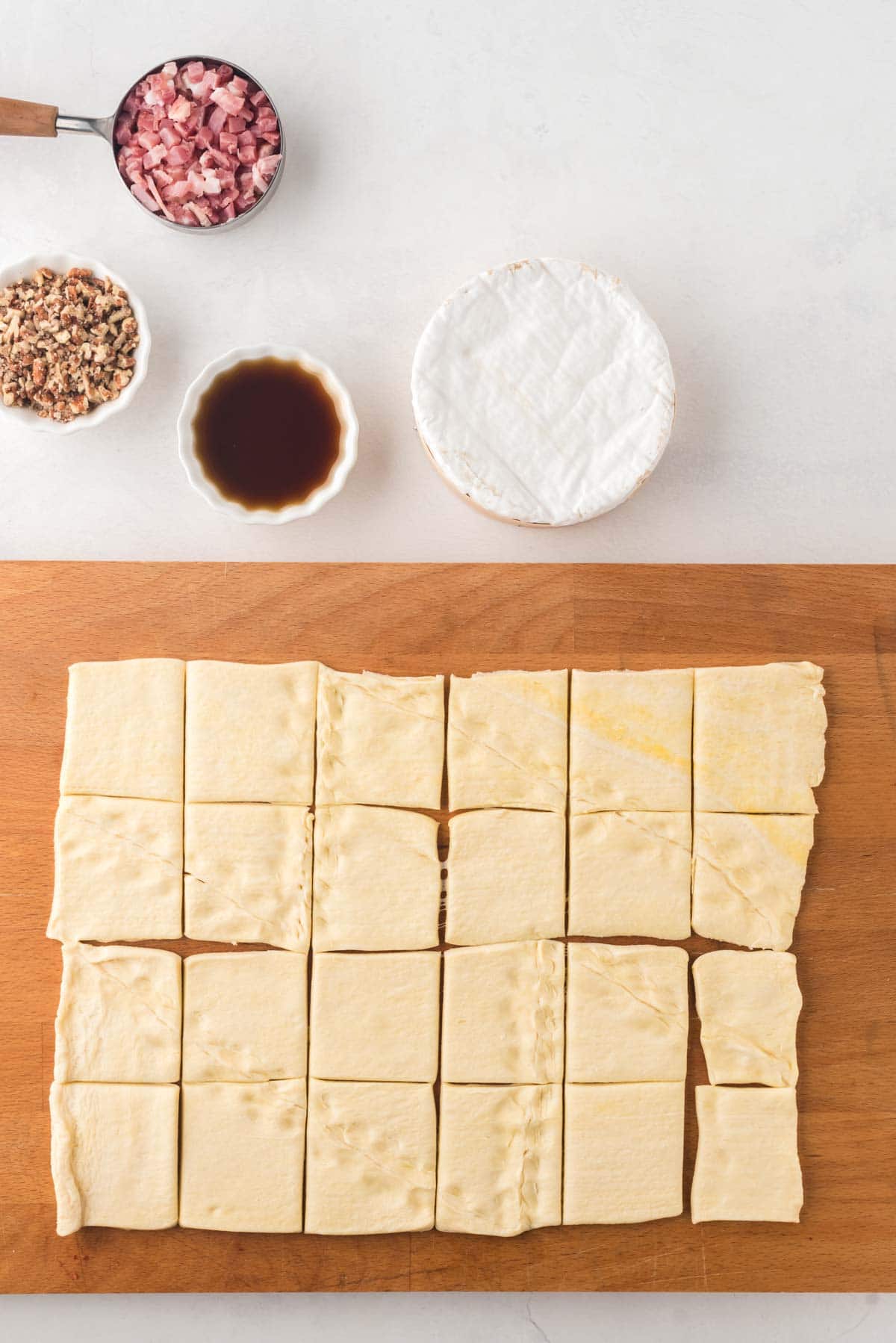 Crescent roll dough cut into 24 squares