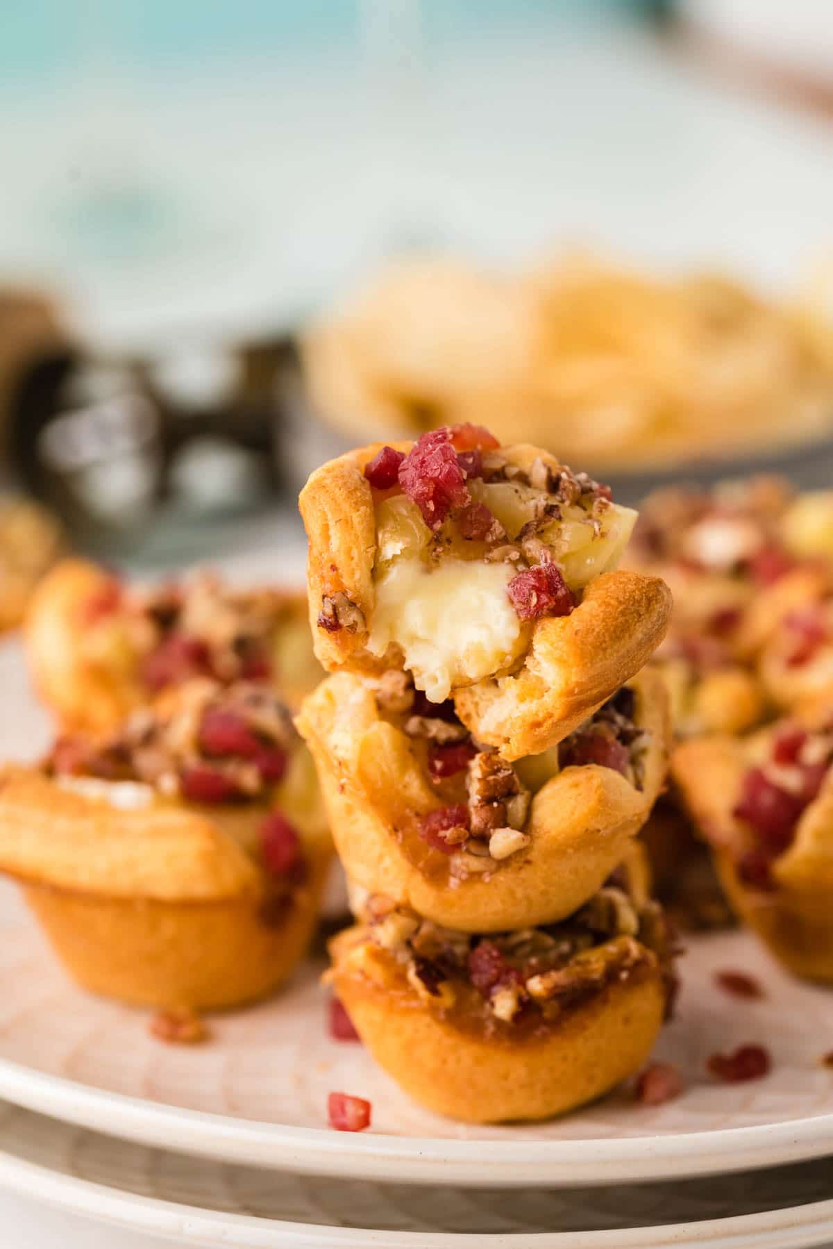 Three stacked bacon brie bites on top of each other