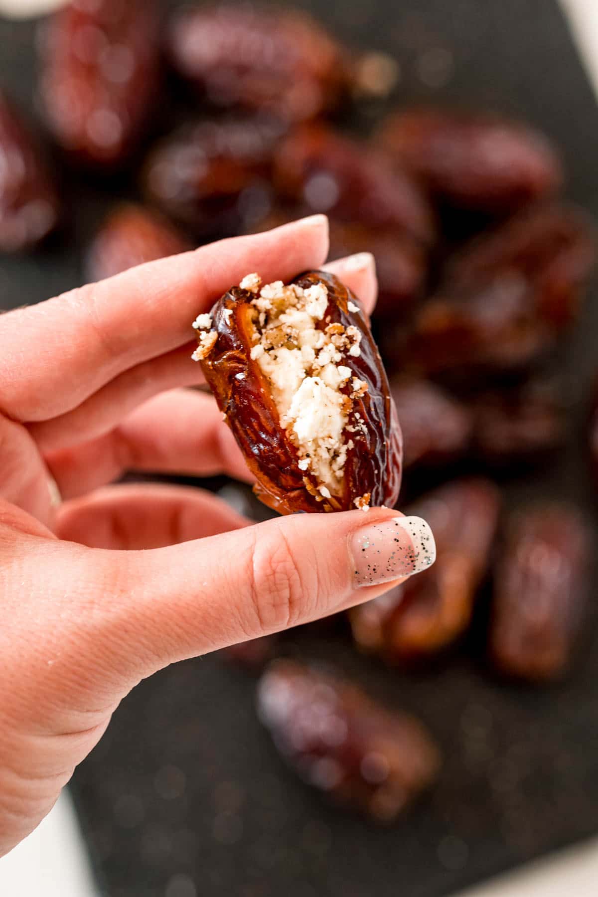 Woman's hand holding a stuffe date