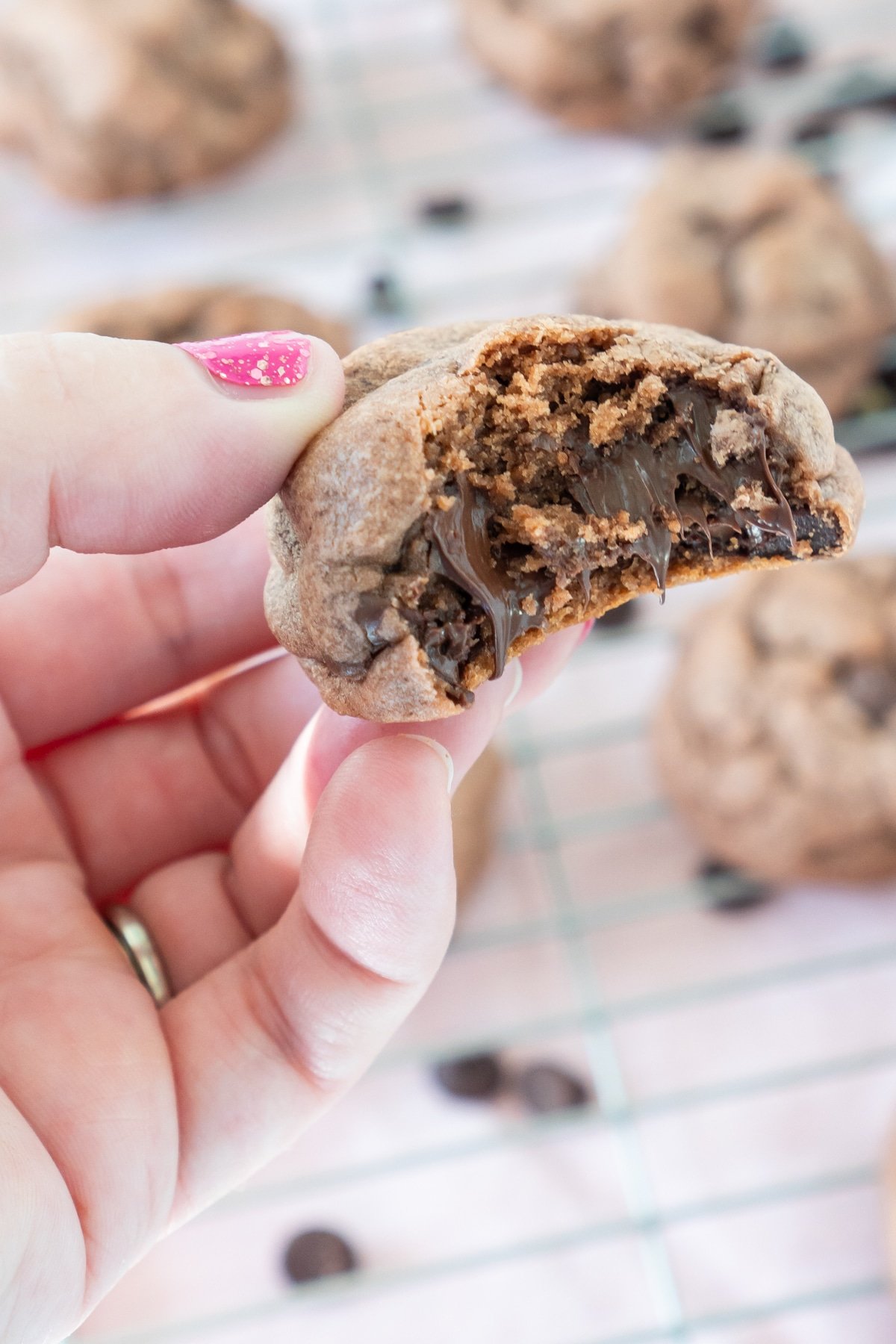 hand holding a chocolate chip pudding cookie