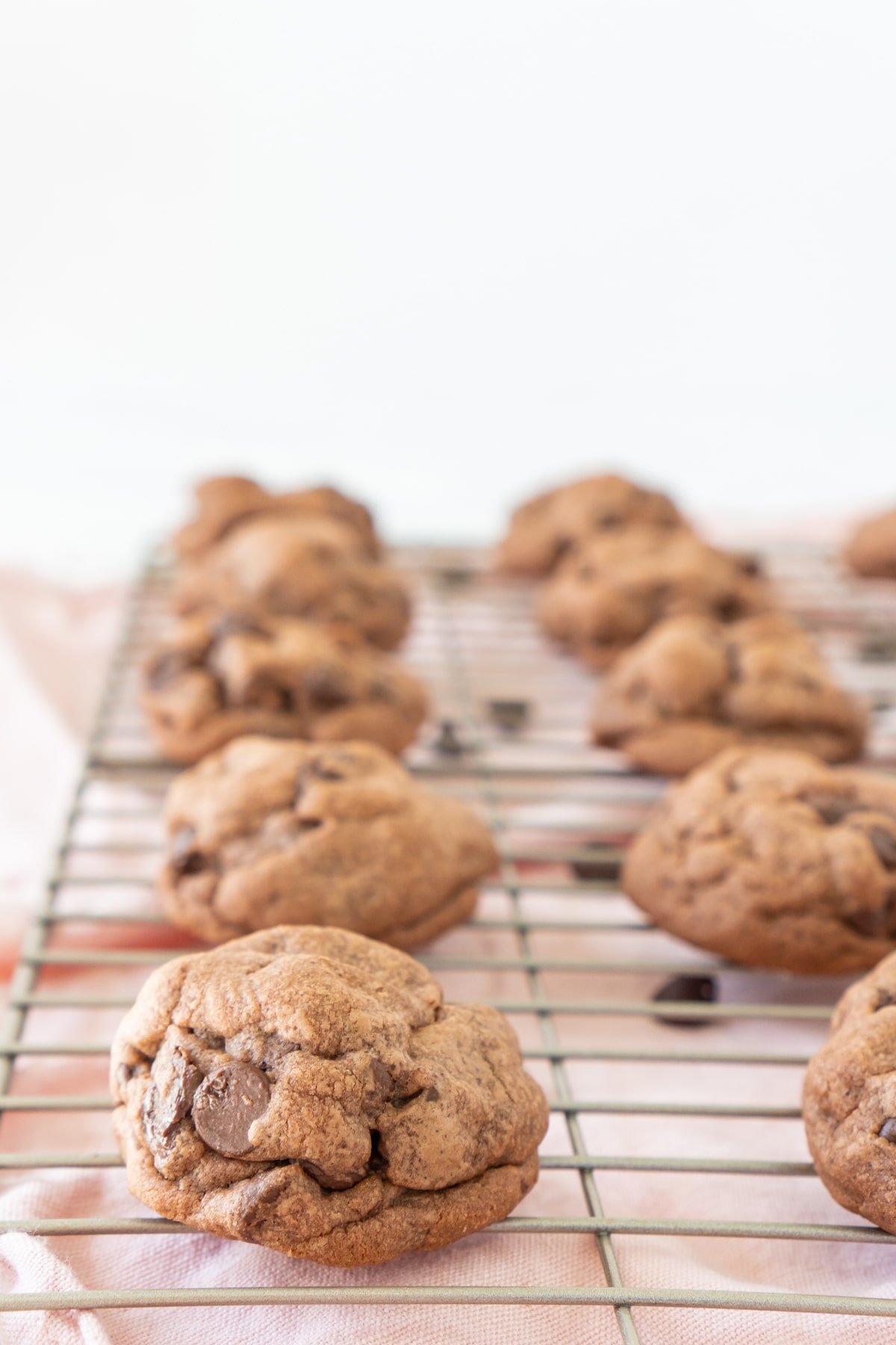 chocolate chip pudding cookies cooling on a cooling rack