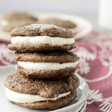 Three chocolate whoopie pies stacked on top of each other