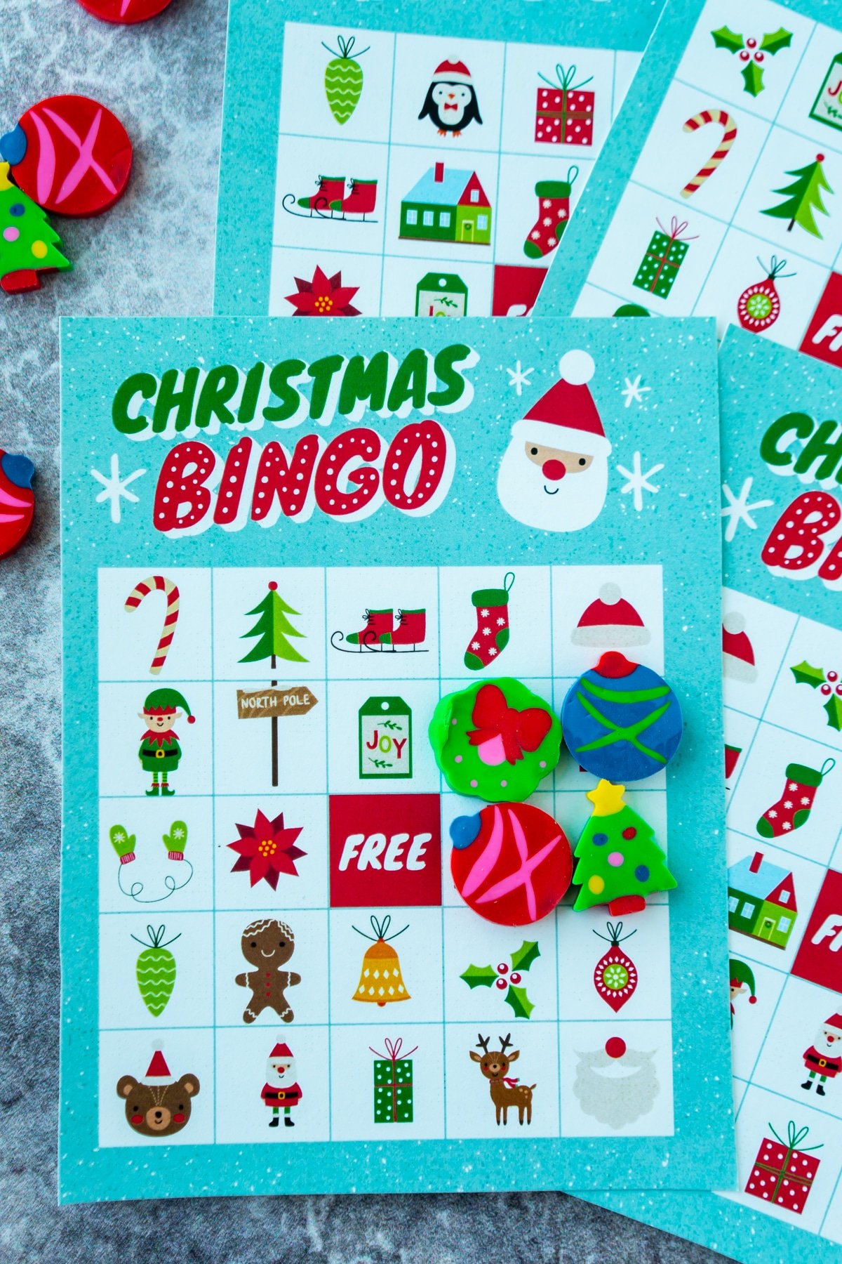 Christmas bingo cards with erasers in a square