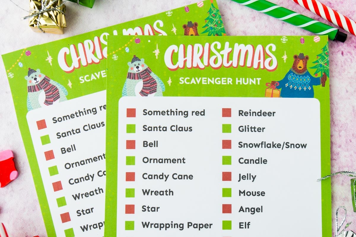 Two Christmas scavenger hunt cards on top of each other