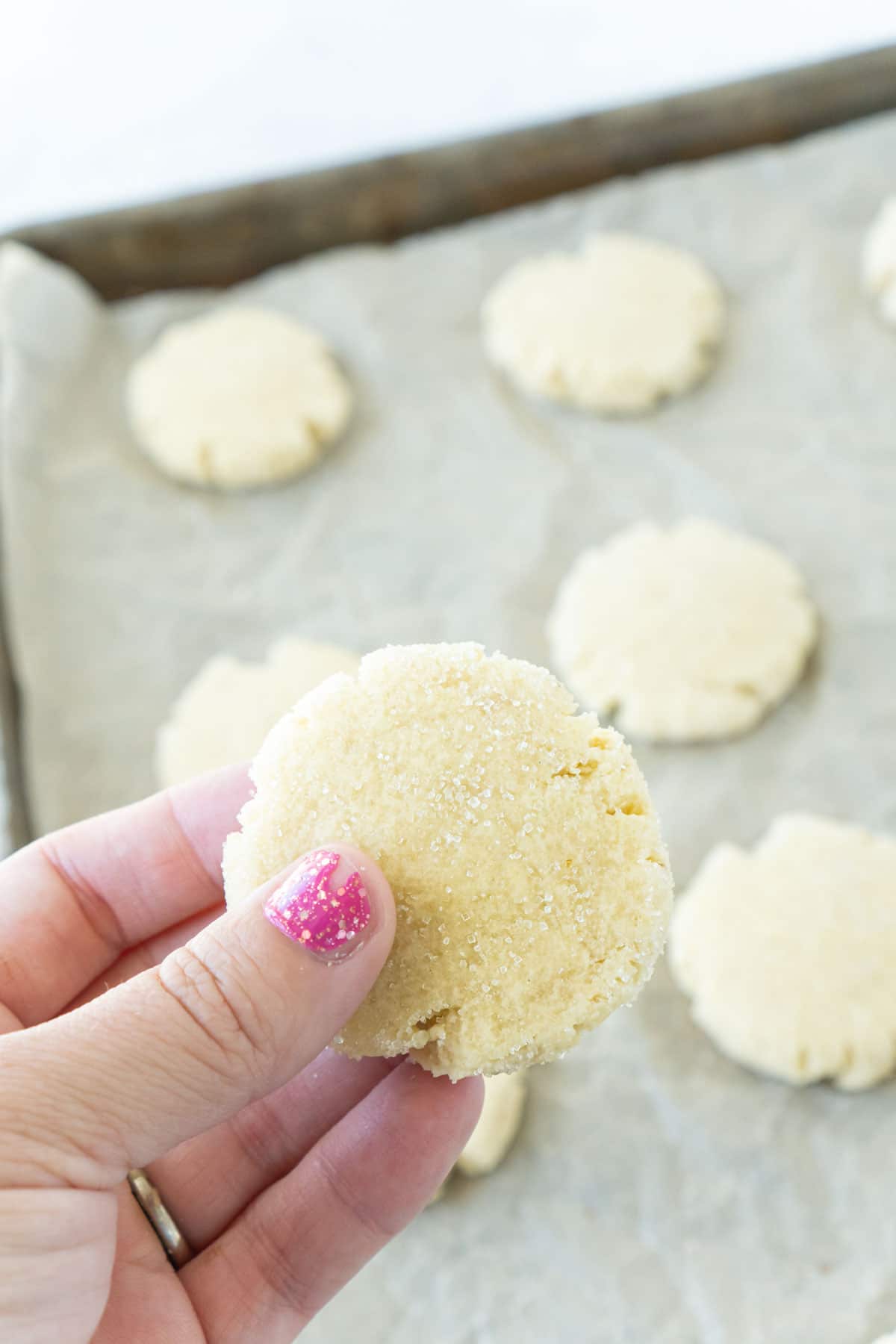 Woman's hand holding a cookie