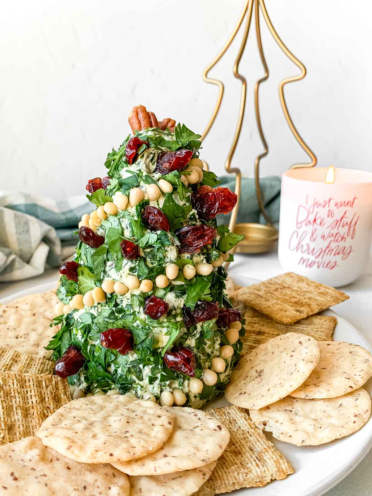 Christmas tree cheese ball surrounded by crackers