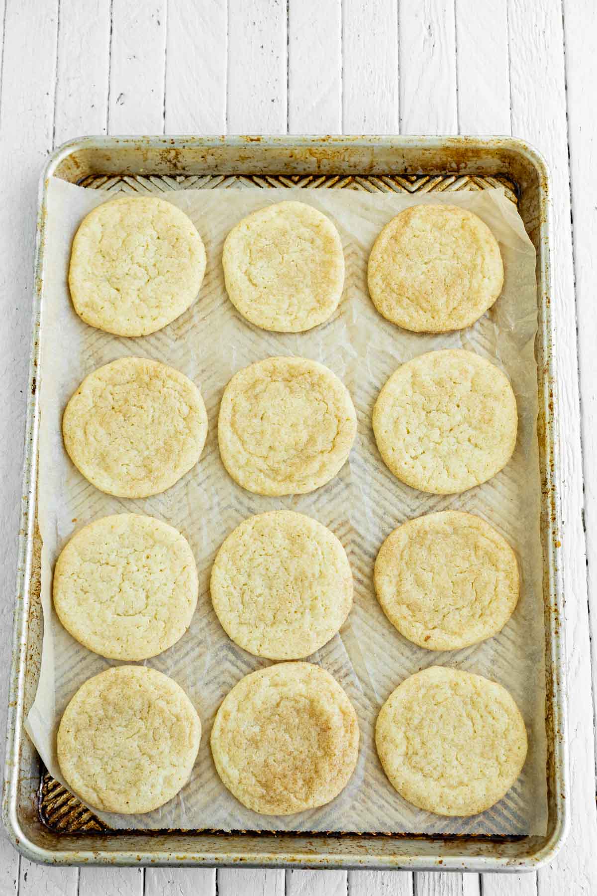 baked snickerdoodles on a cookie sheet