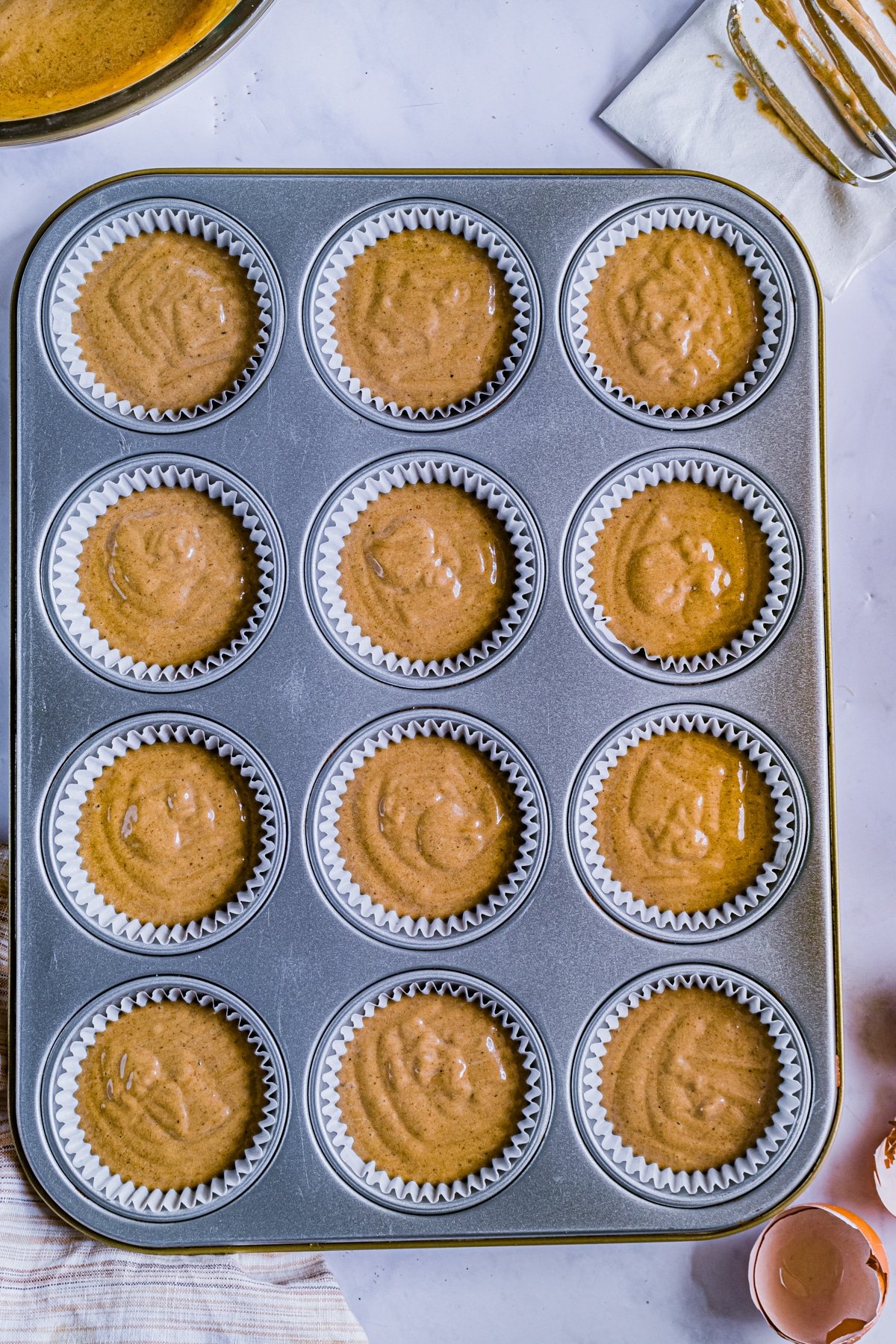 batter for gingerbread cupcakes in muffin tins