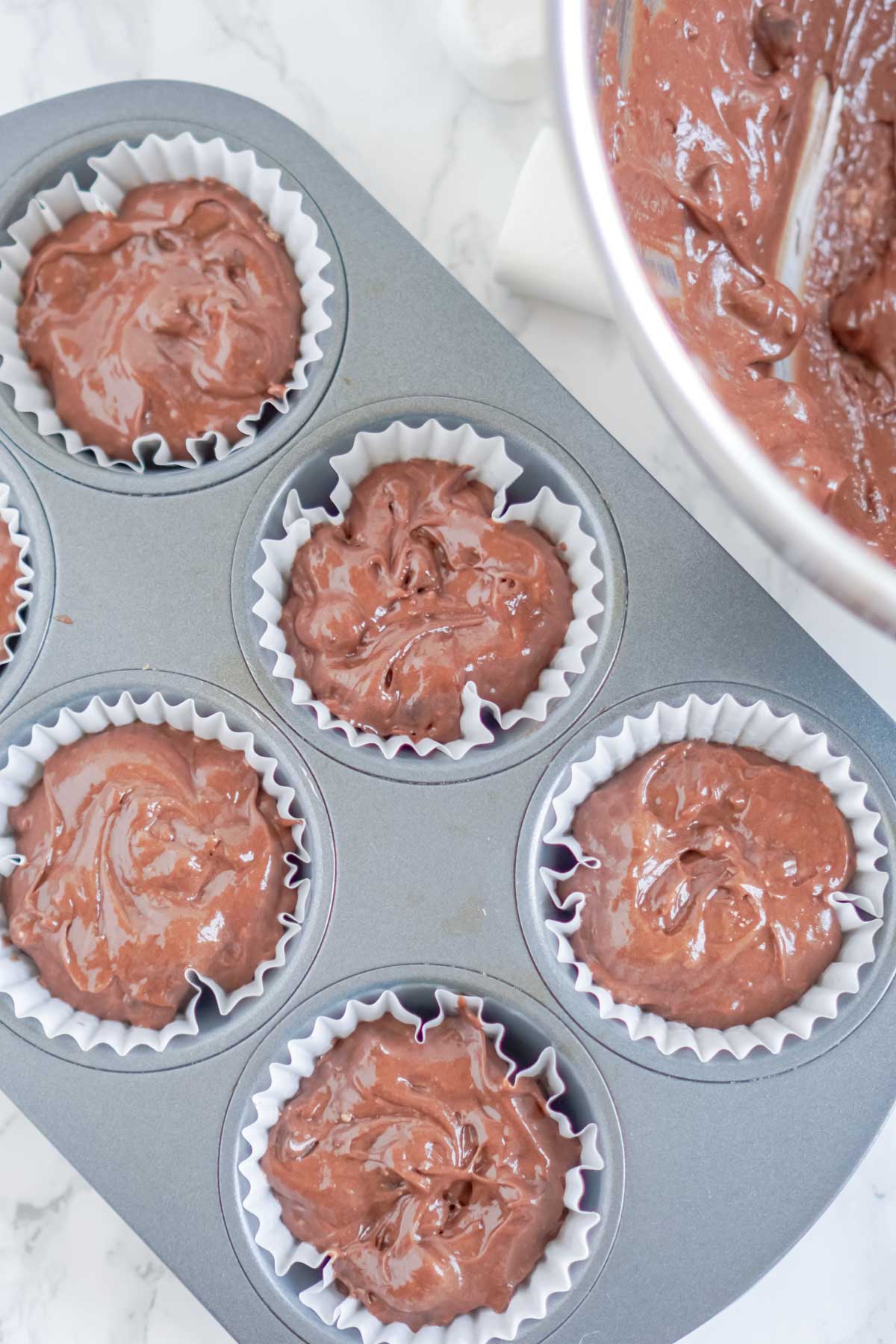 Batter for hot chocolate cupcakes in cupcake tins