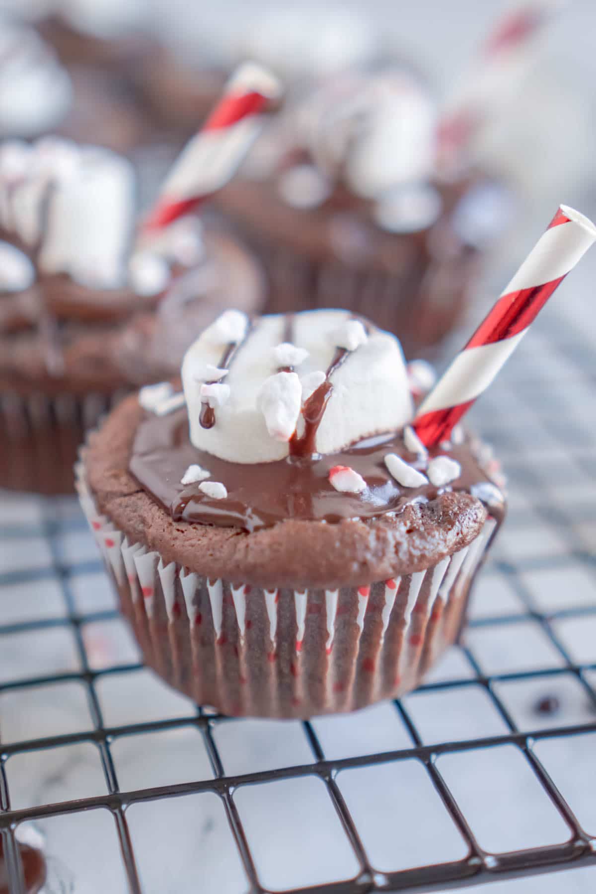 Hot chocolate cupcakes on a baking rack