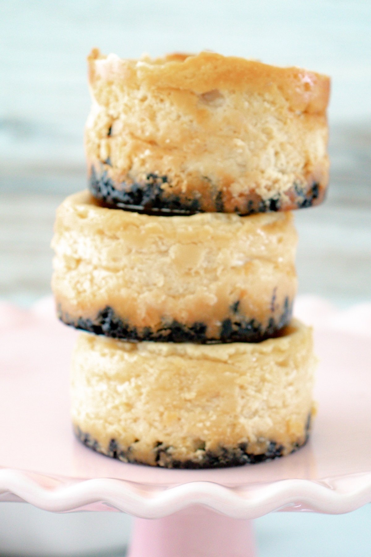 Three mini Oreo cheesecakes stacked on top of each other