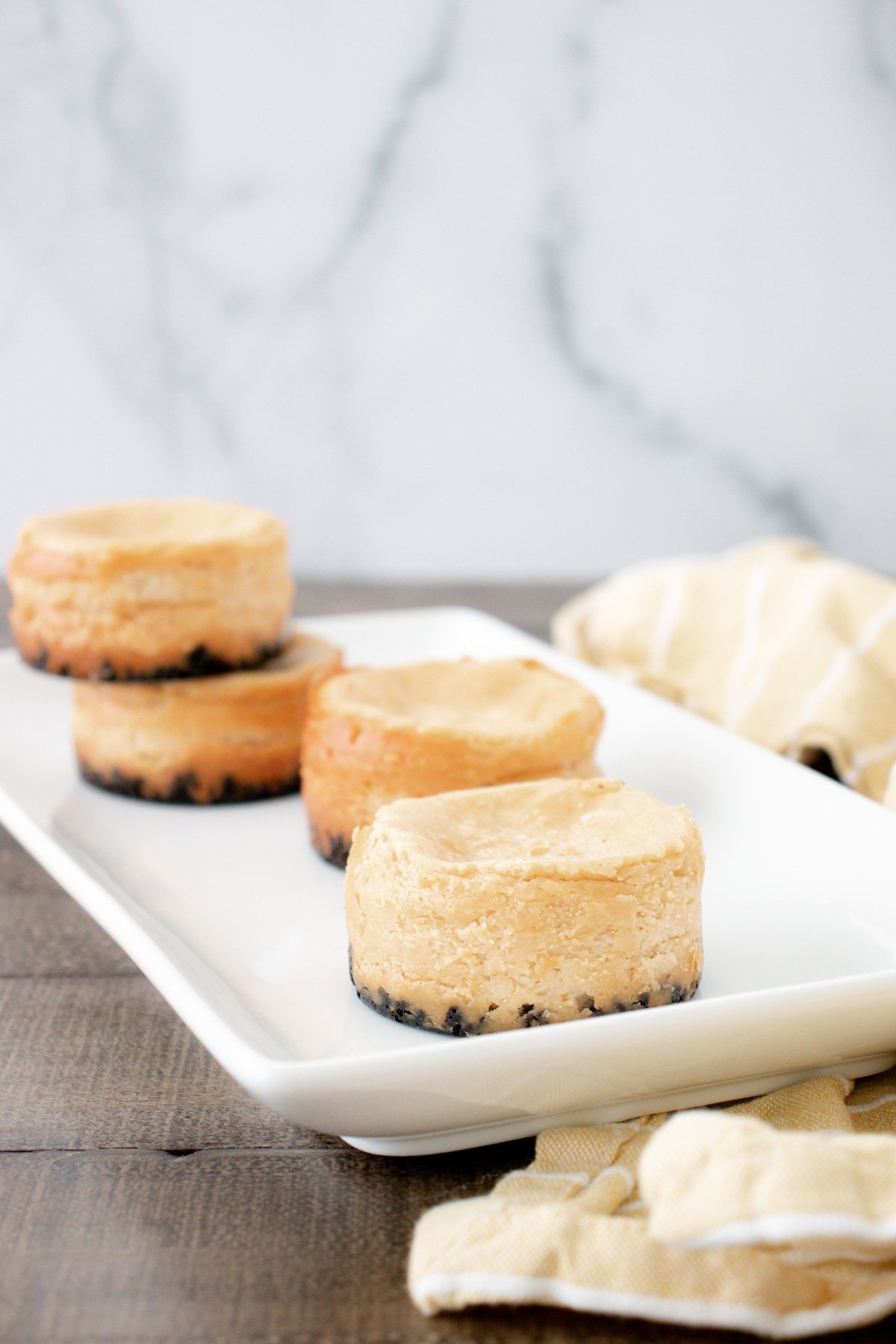 Mini Oreo cheesecakes on a white plate