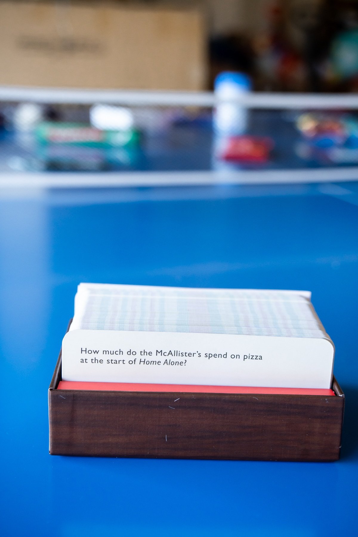 Christmas trivia cards on a ping pong table