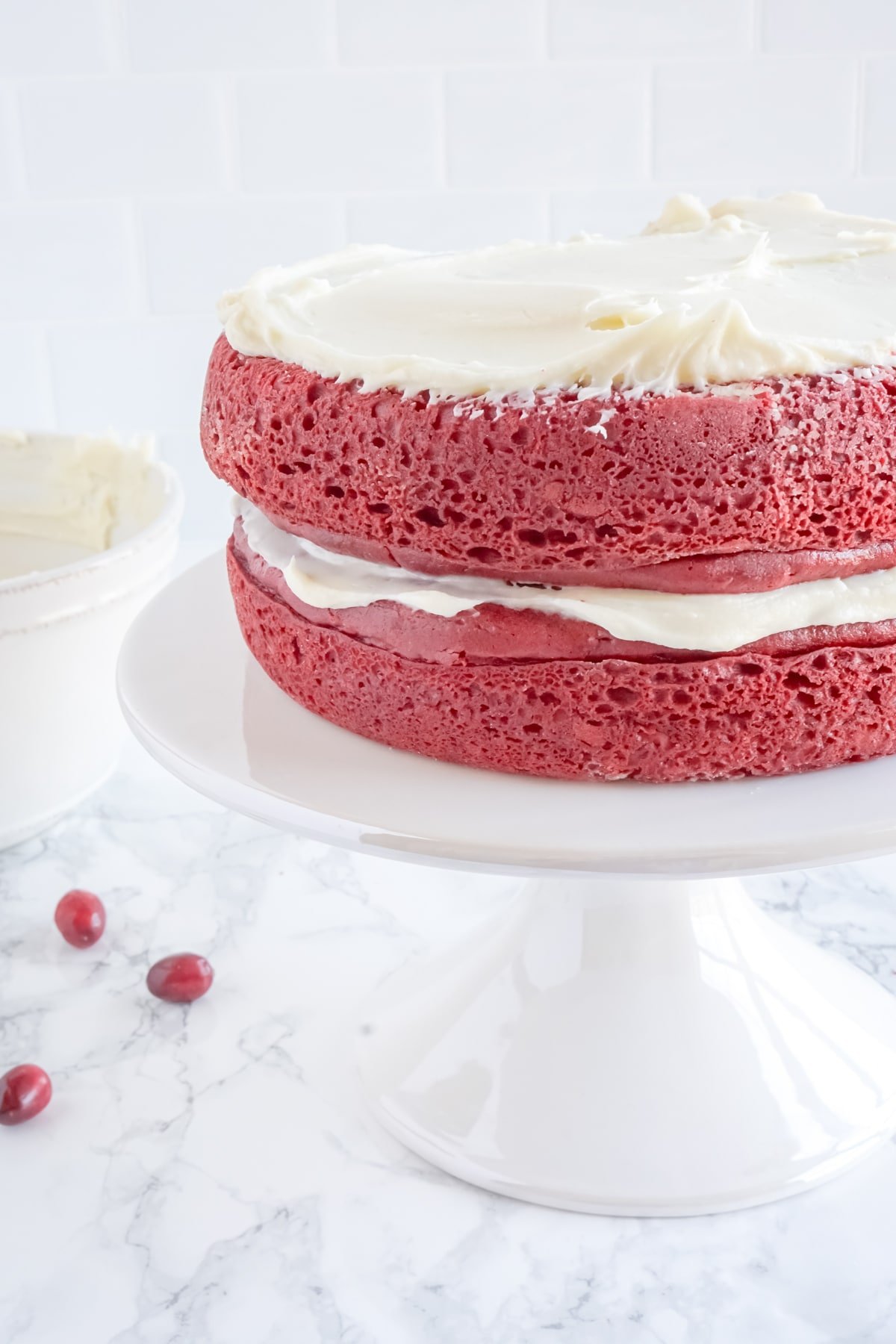 two layers of red velvet cake with cream cheese frosting