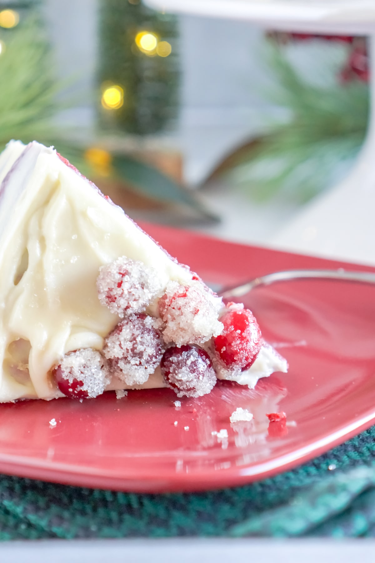 sugared cranberries on a plate with cake