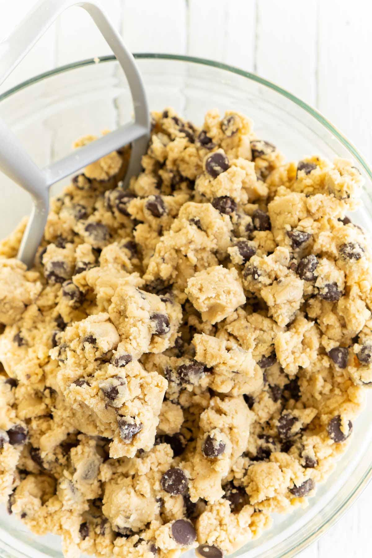 Dough for rolo cookies in a glass mixing bowl