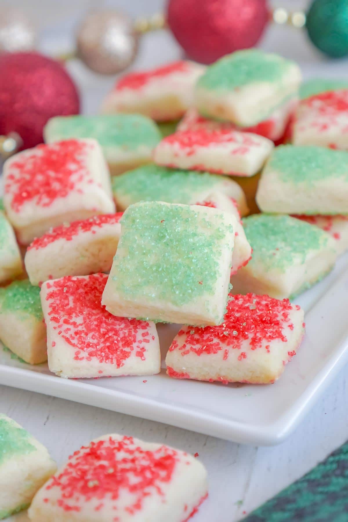 sugar cookie bites with Christmas sprinkles in a pile