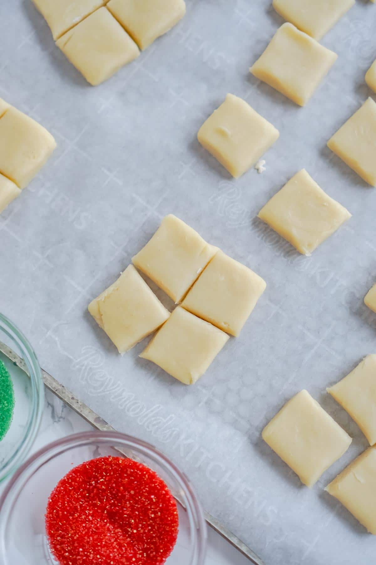 sugar cookie bites on a cookie sheet