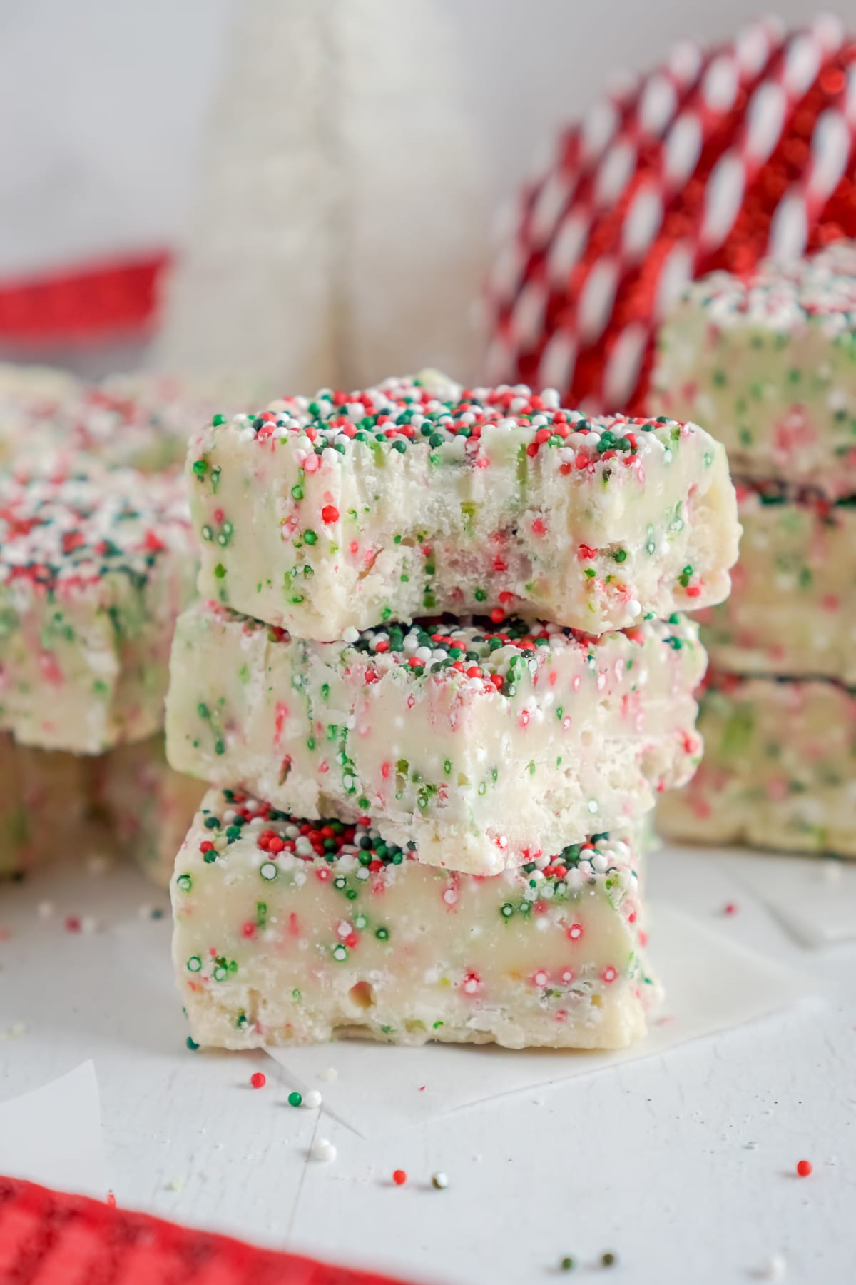 Three pieces of white chocolate fudge stacked