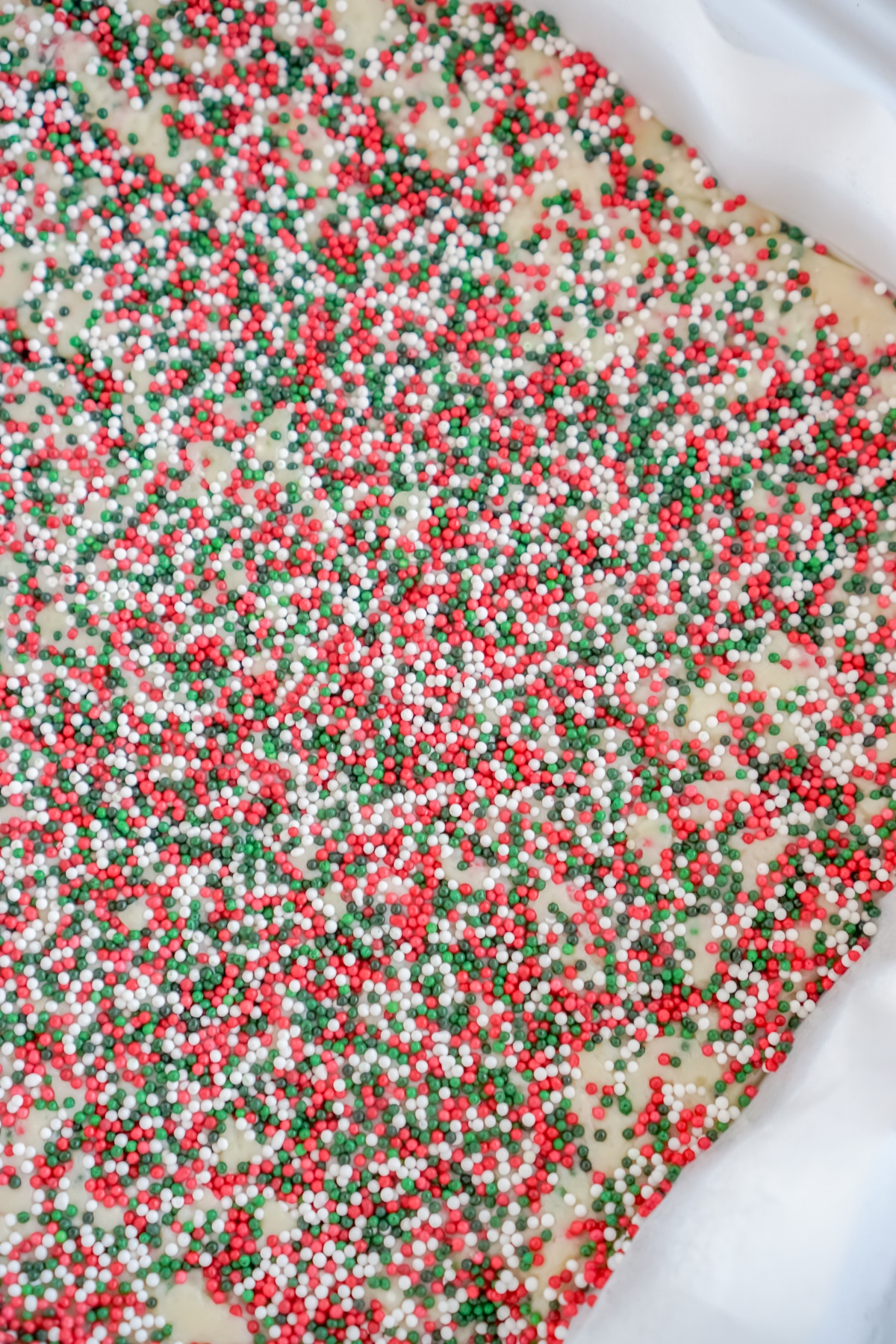 White chocolate fudge with sprinkles on top in a pan