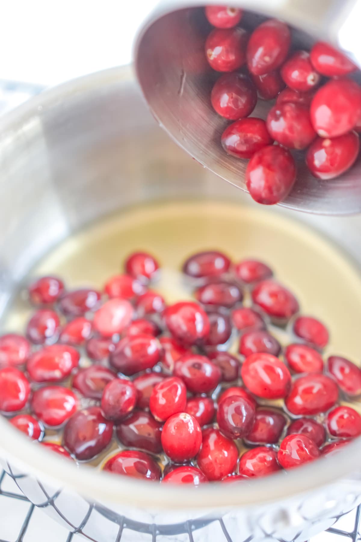 bowl with cranberries and simple syrup